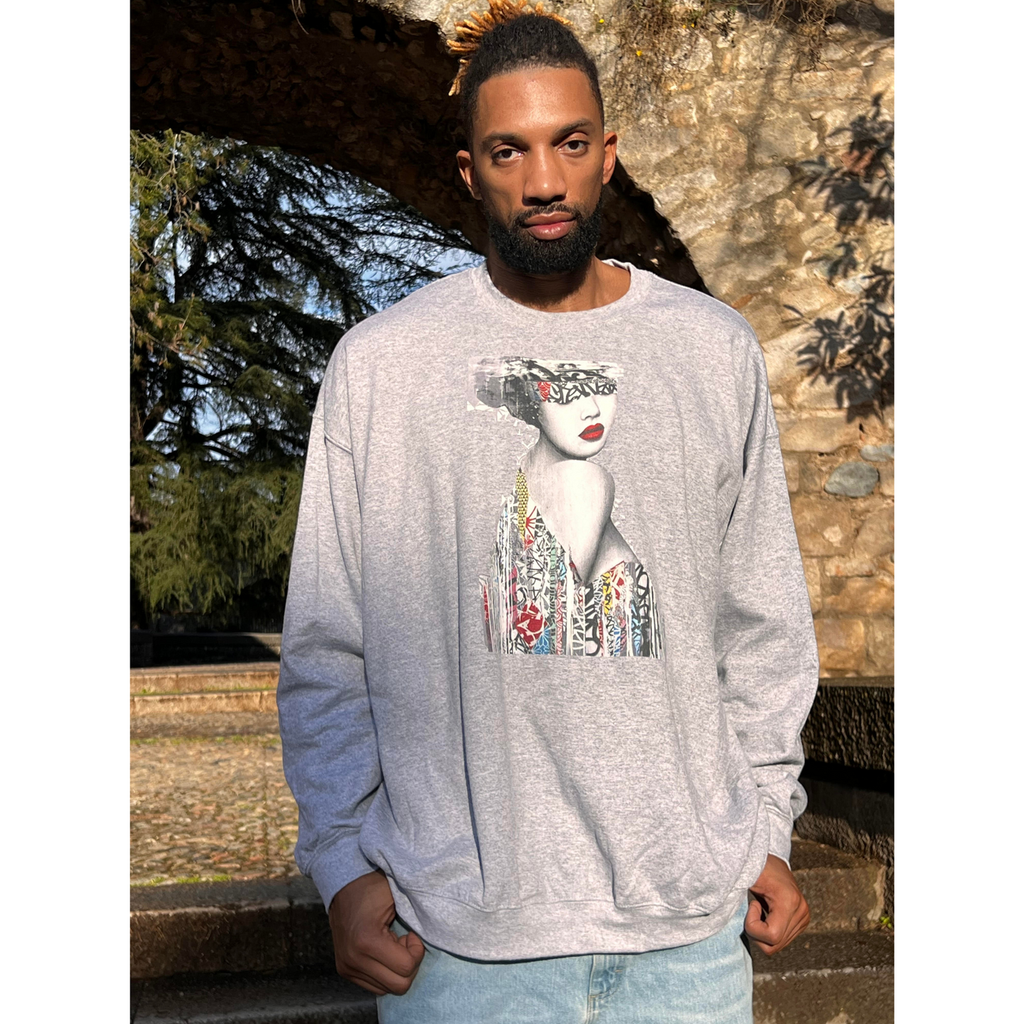 Gray collage art sweatshirt with bold woman portrait print – worn by Khem Birch, streetwear pullover with artistic design