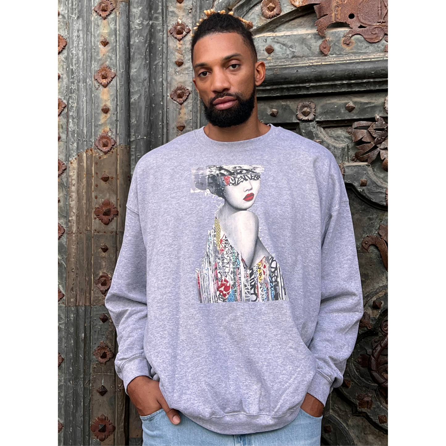 Khem Birch wearing gray collage art sweatshirt with bold woman portrait design – streetwear pullover for artistic fashion lovers