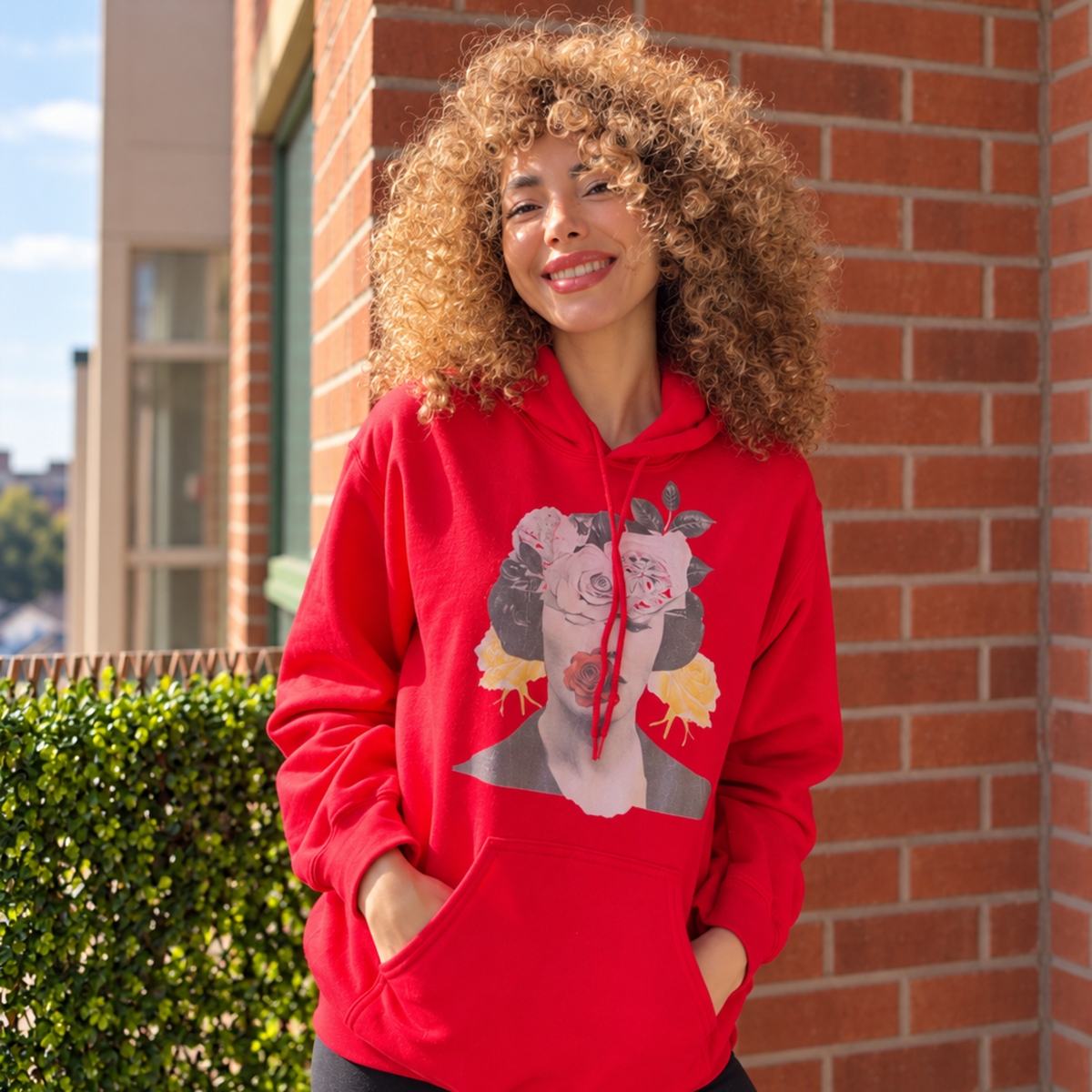 Front view of an ONLYZ3AL red floral portrait hoodie, showing the printed artwork, drawstring hood and kangaroo pocket.