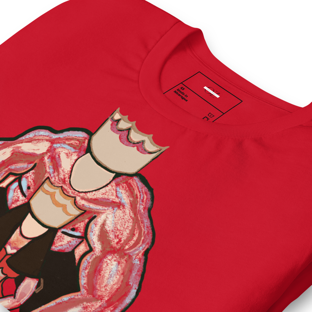 Red t-shirt with a striking graphic design featuring a muscular king and queen in a powerful embrace, displayed on a light wooden background with festive decorations and gift boxes.