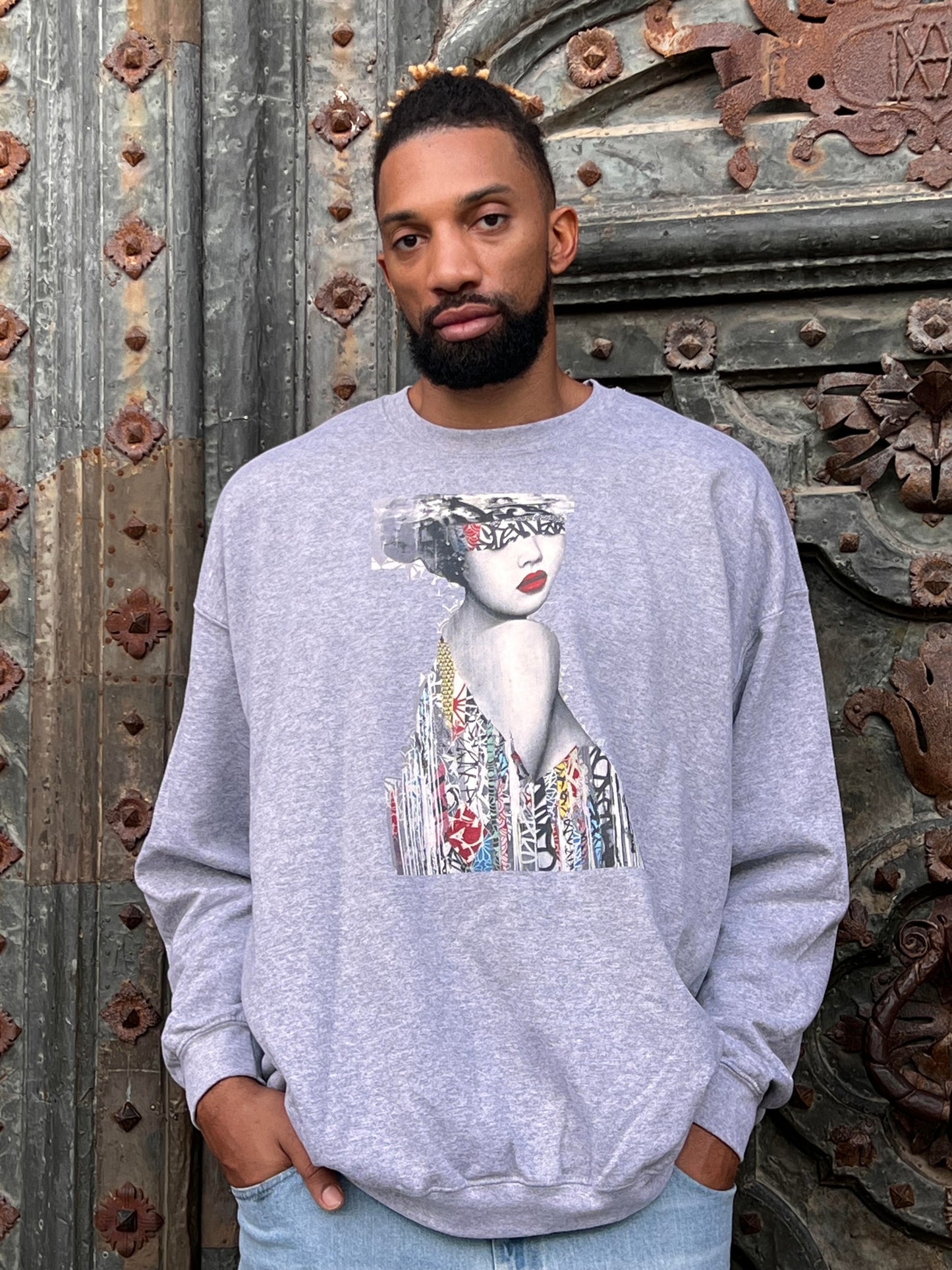 Khem Birch is wearing a sturdy and warm sweatshirt, bound to keep him warm in the colder months. It's a pre-shrunk, classic-fit sweater made with air-jet spun yarn for a soft feel and reduced pilling.