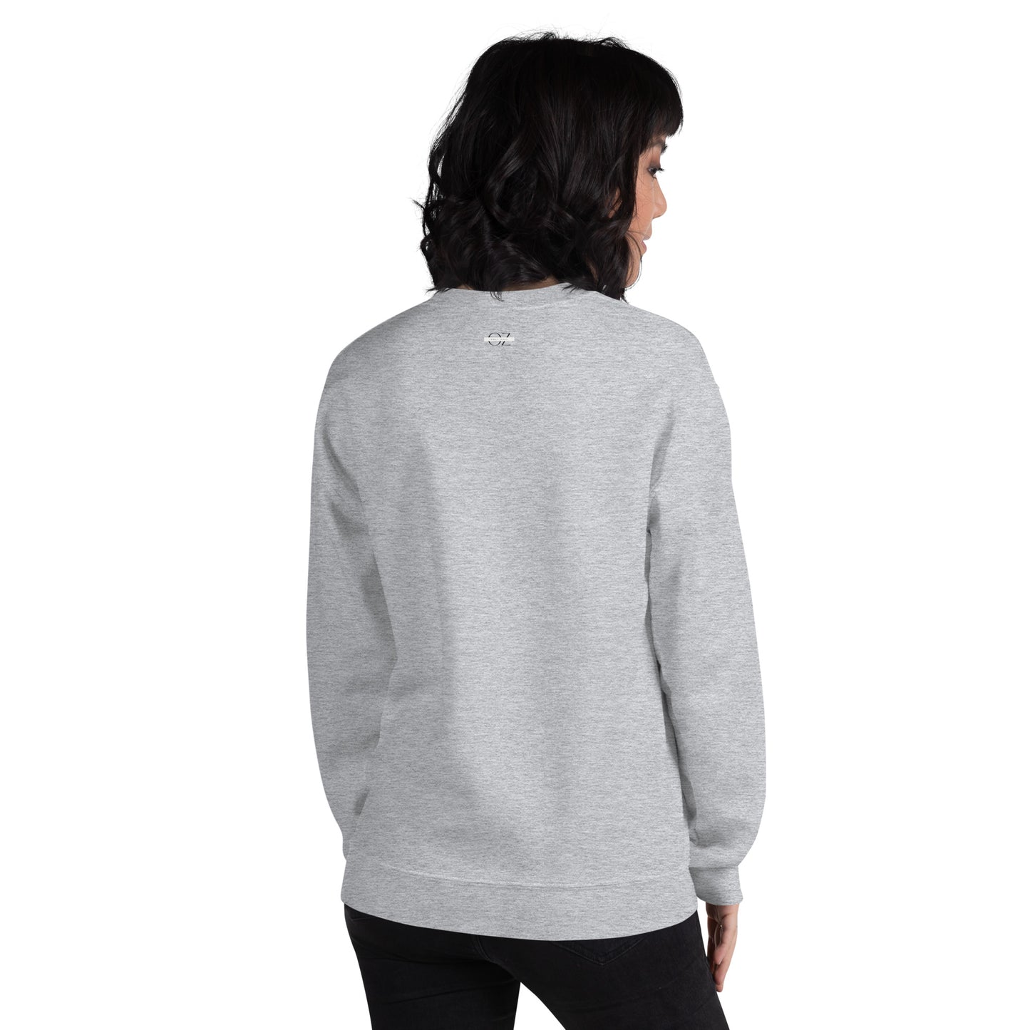 Woman wearing grey Sagittarius zodiac sweatshirt with bold quote – I was born with fire in my soul and a mouth I can’t control – standing in front of red sports car, casual astrology-themed fashion.