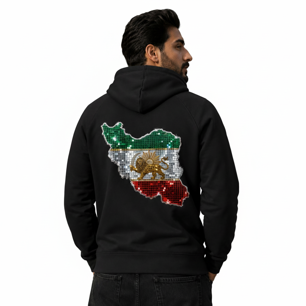 A man wearing a black hoodie from the back, featuring a large graphic of the map of Iran covered in sequins styled with the Iranian flag (green, white, red, and the golden lion emblem).