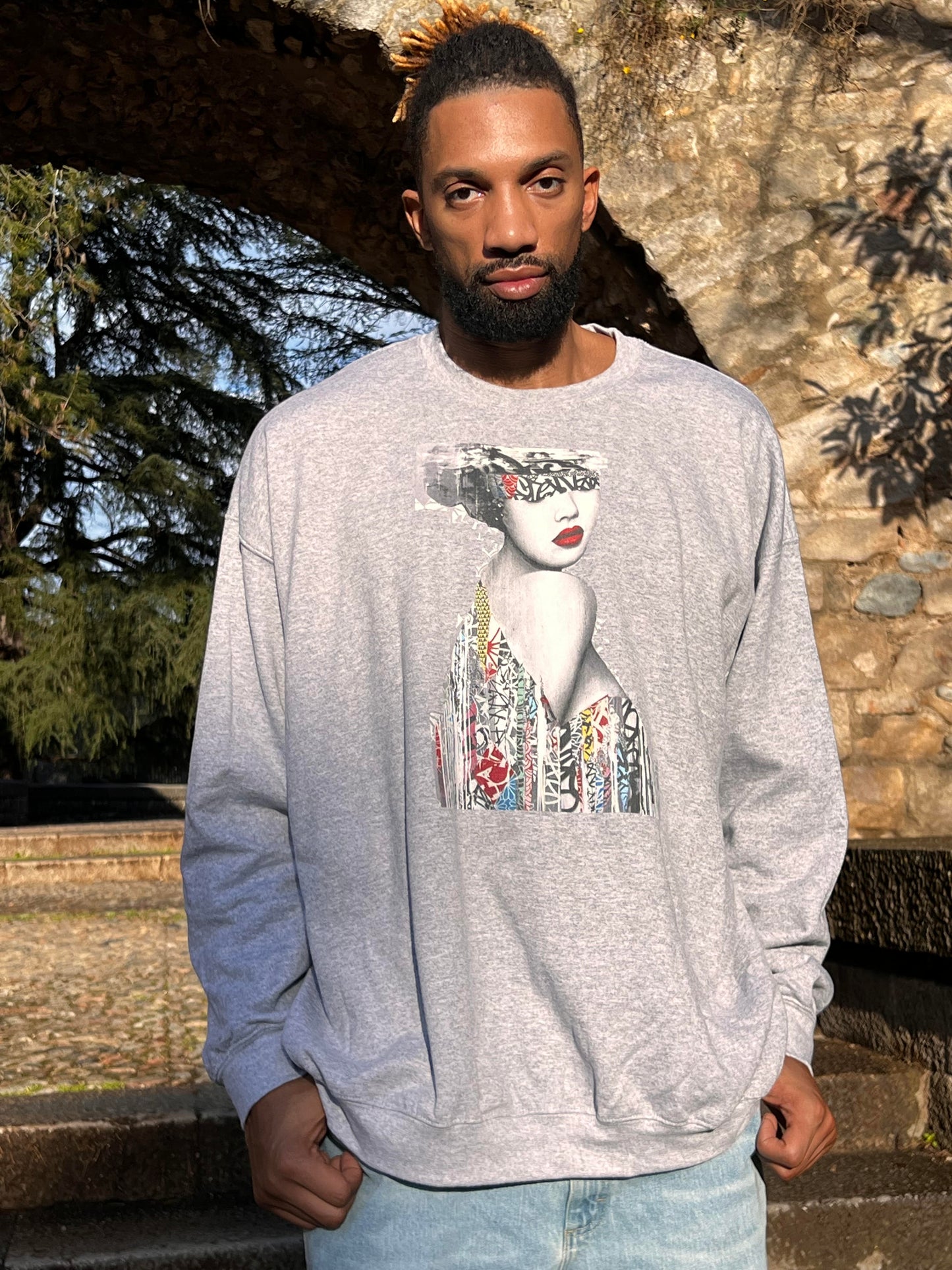 Khem Birch is wearing a sturdy and warm sweatshirt, bound to keep him warm in the colder months. It's a pre-shrunk, classic-fit sweater made with air-jet spun yarn for a soft feel and reduced pilling.
